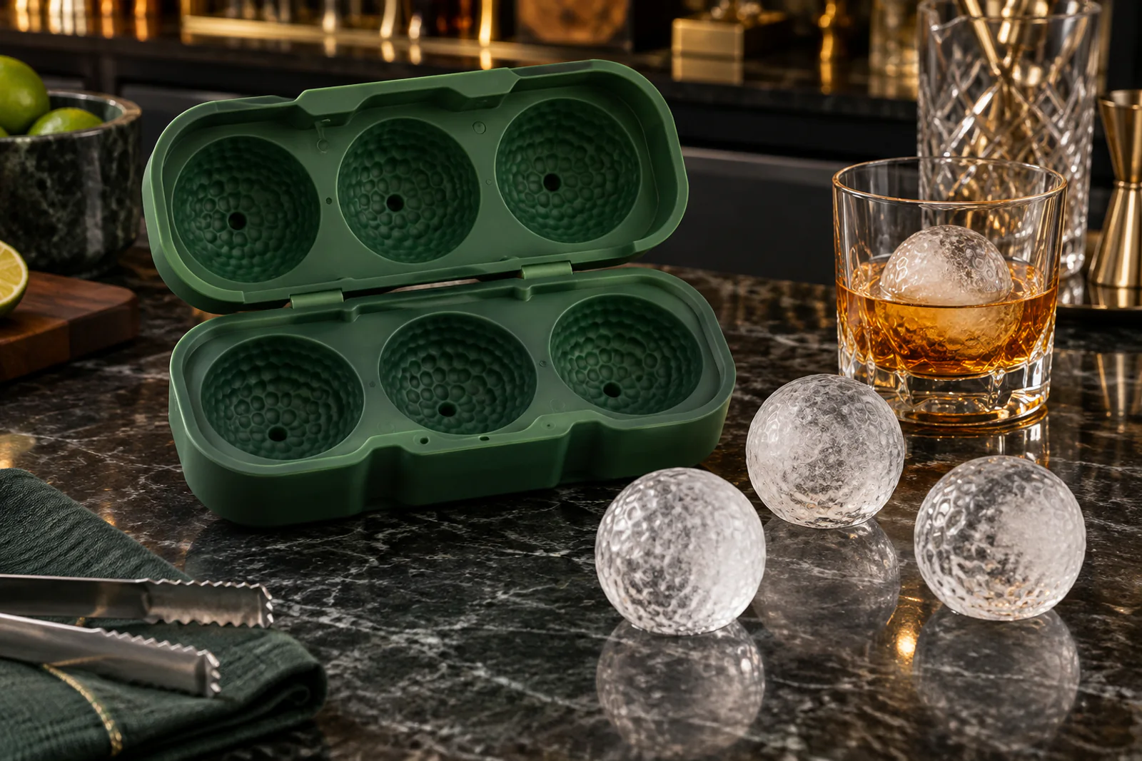 Forest green custom silicone golf ball ice mold with released dimpled ice spheres
