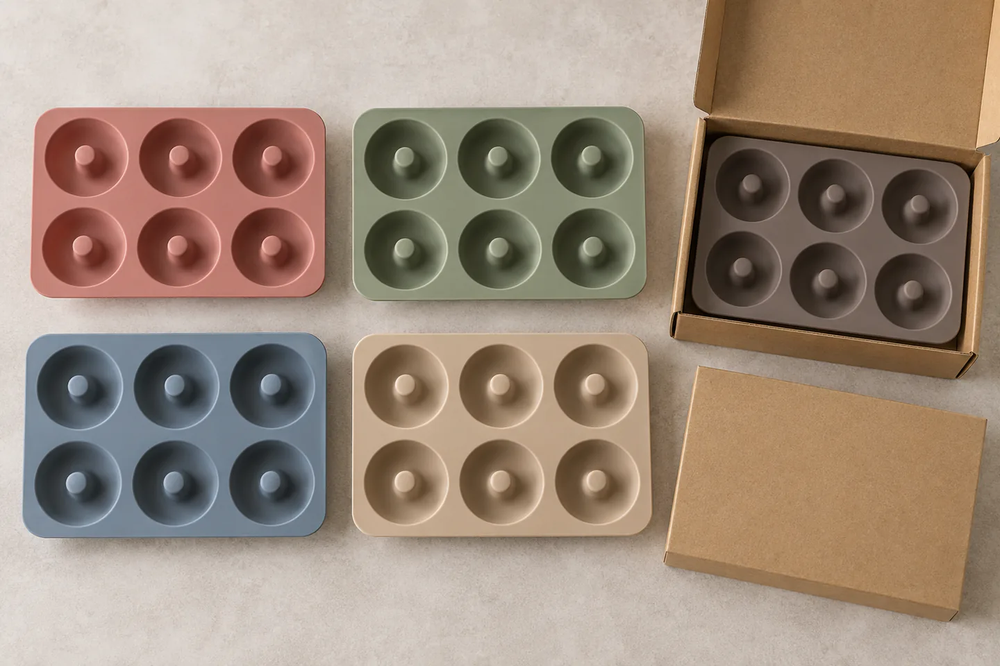 Private-Label Color and Packout Approval Four identical six-cavity silicone donut molds with blank kraft retail boxes